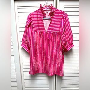 NWOT pink striped, loose cut shirt. Size M but fits more like a L